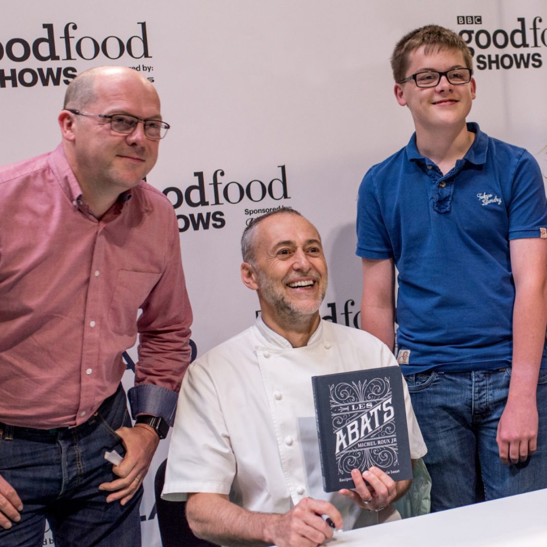 Michel Roux with his book 'Les Abats' at book signing with fans at BBC Good Food Show