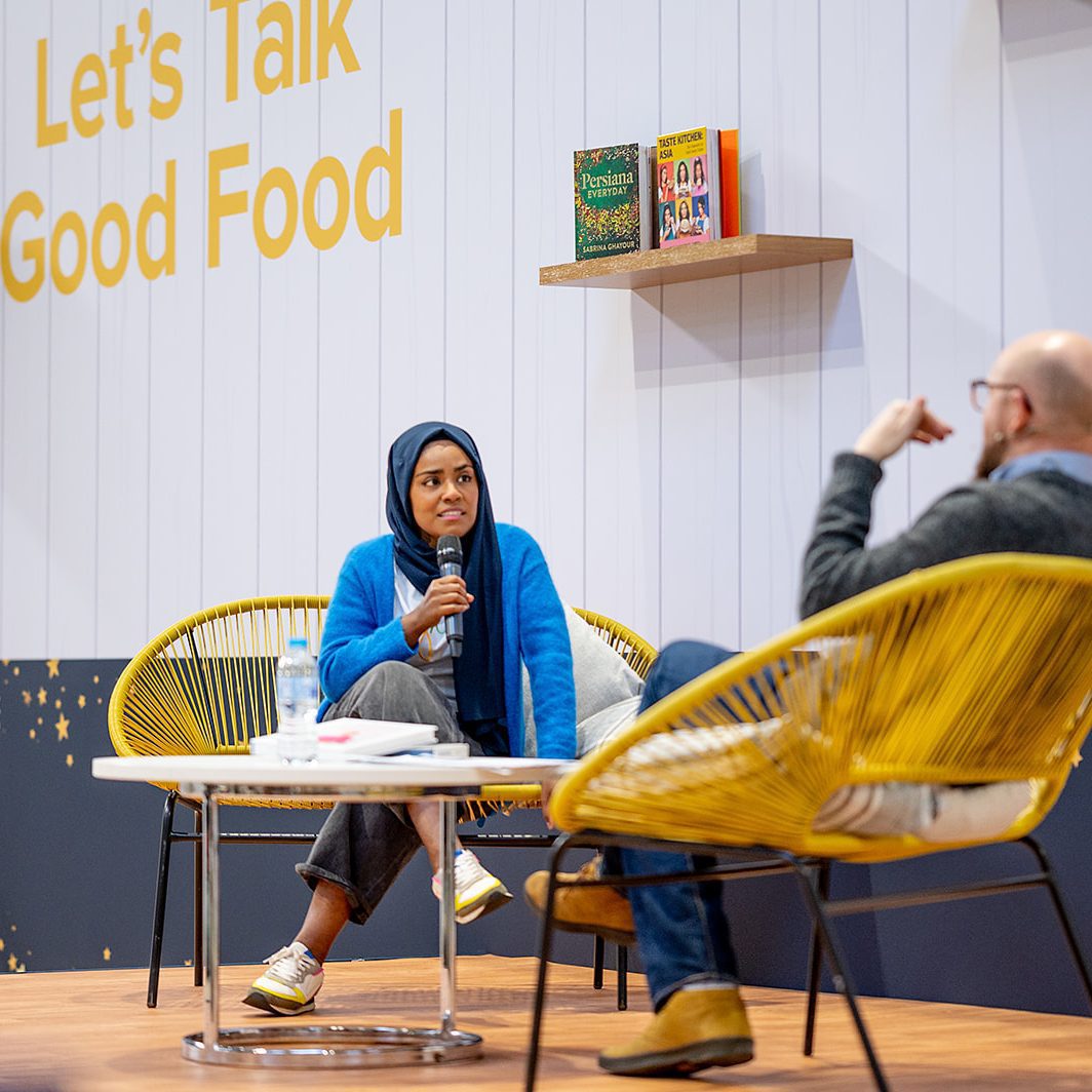 Nadiya Hussain talking onstage in interview with Barney Desmazery at BBC Good Food Show